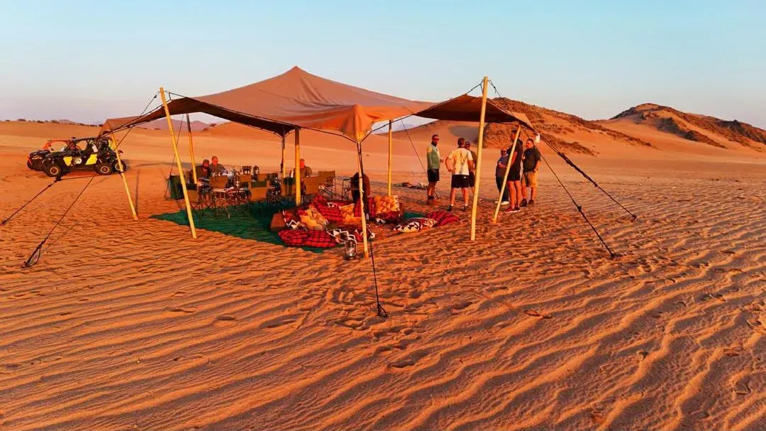 Golden hour at a luxury camp deep in Iona National Park