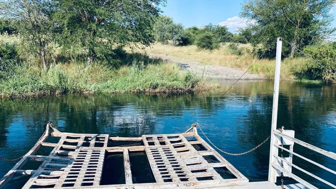 A hand-hauled pont ferries the convoy across the Kavango