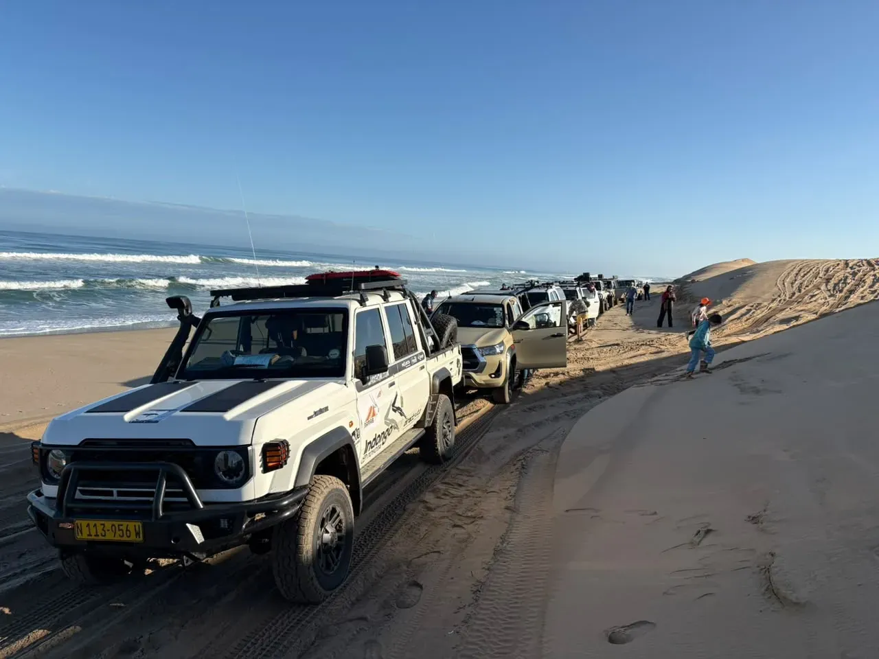 The guided convoy strung along the Atlantic beach below the dunes