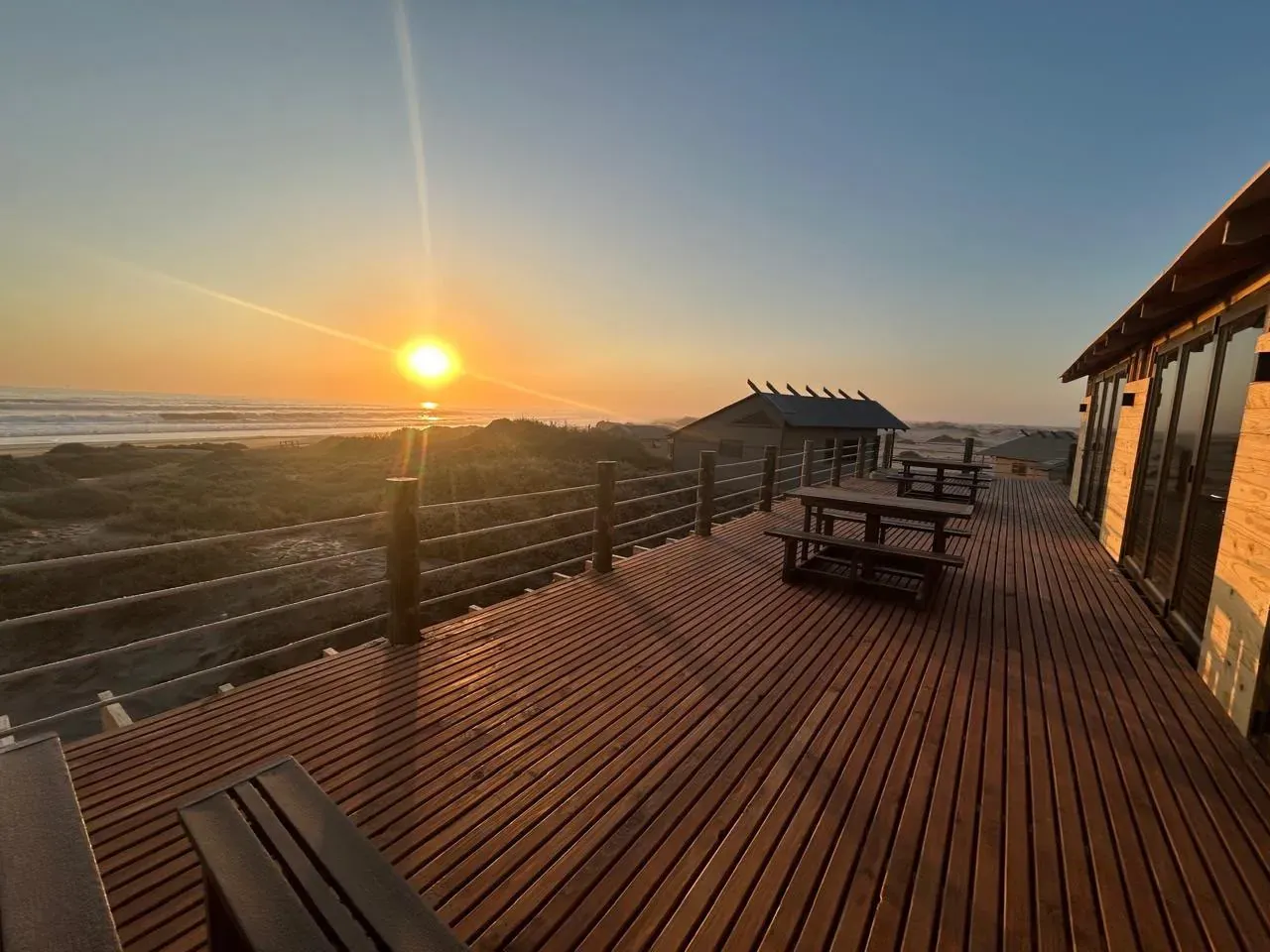 Golden hour along the boardwalk deck at Meob Lodge