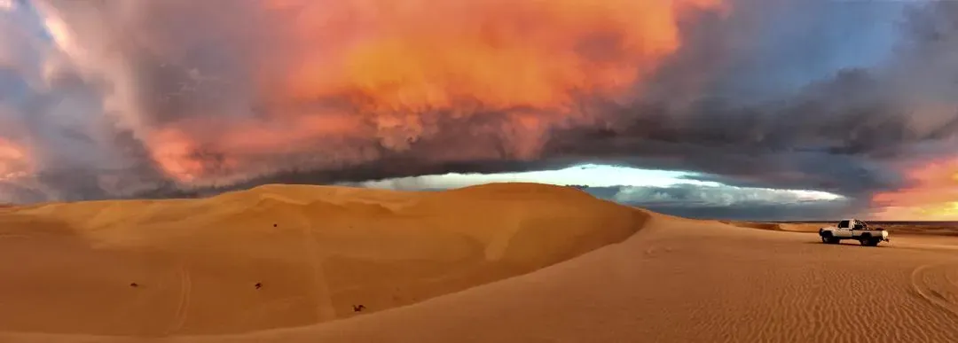 Storm light burning over the dunes at the end of the day