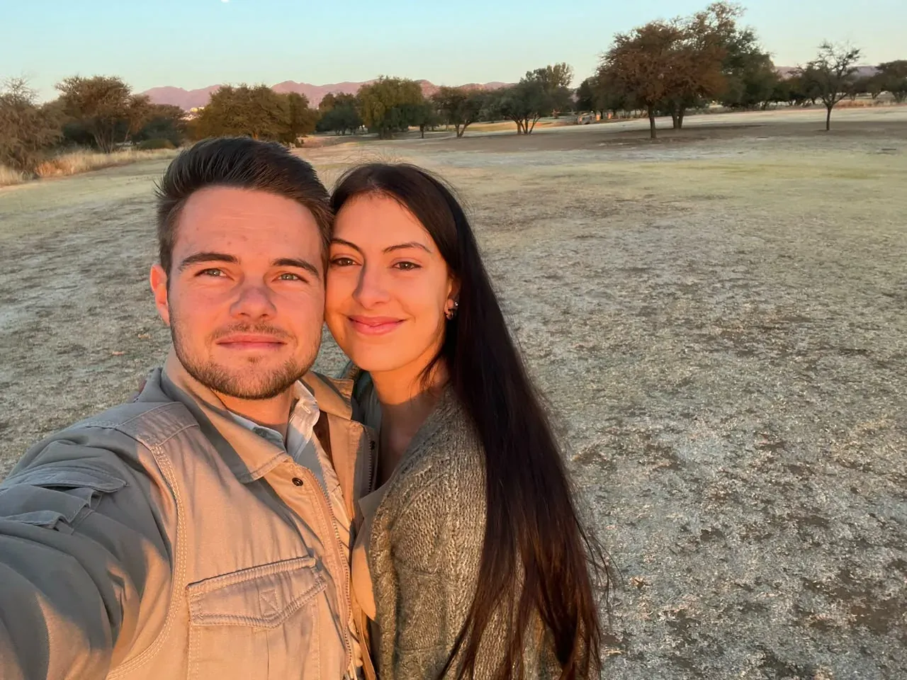 Louis, co-founder of Sandura Tours, with family at sunset in Namibia